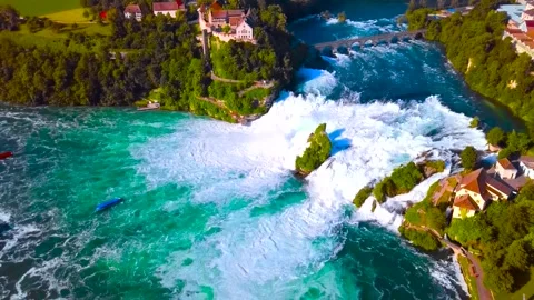 Aerial View of Massive Waterfall with Rushing White Water and Cliffside Cast Stock Footage 346732621