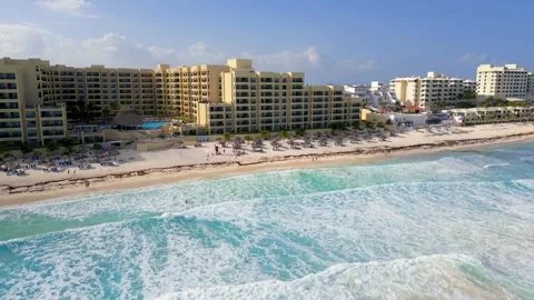 Aerial view of massive waves in Caribbean sea and many luxury resorts and b.. Stock Footage 324011545