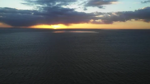 Aerial view of massive windmill offshore power stations turbines Stock Footage 107585383