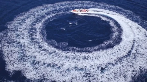 Aerial view of a maxi rib navigating fast in circle. Stock Footage 82275629