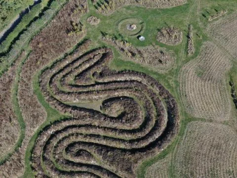 Aerial view of a maze pattern made in a field in the countryside Stock Photos
