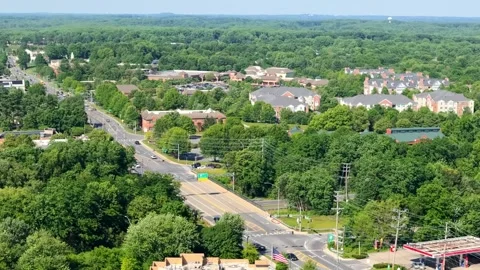 Aerial View of MD‑108 Bridge Over MD‑32 and Wake Forest Road Neighborhood Stock Footage 336699145