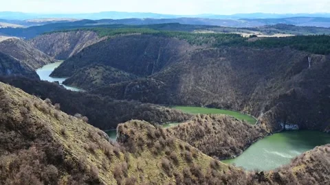Aerial view of meanders at rocky river Uvac gorge on sunny day, southwest Serbia Stock Footage 274261880