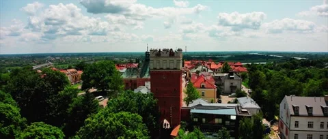 Aerial view of medieval brick gate tower with rooftop visitors Stock Footage 319556613