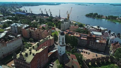 Aerial view of a medieval clock tower in heart of Vyborg old town. Panoramic Video stock 234588148