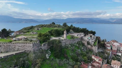 Aerial view of medieval old clock tower in Acronafplia castle old town of Nafpli Video stock 300780854