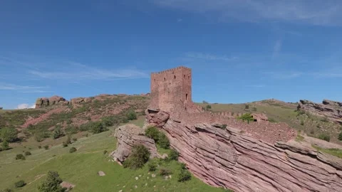 Aerial view of a medieval tower ruin under deep blue sky Stockbeeldmateriaal 343325549