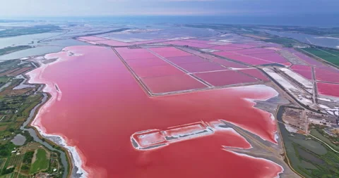 Aerial view of the medieval walled town of Aigues-Mortes near the pink salt lake Stock Footage 328100697