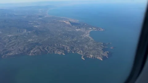 Aerial view of the Mediterranean coastline featuring rugged cliffs Stock Footage 294103157