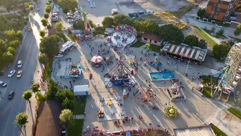 Aerial view of the medium size roller coaster at the amusement park in the city Stock Photos