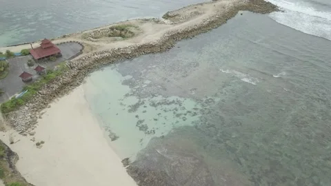 Aerial view of Melasti beach. Sea waves. Bali island, Indonesia. Cloudy. Ocean Stock Footage 133632653