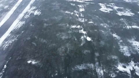 Aerial view of melting ice on the surface of the lake. Stock Footage 180561375