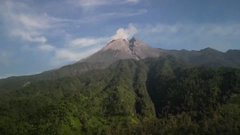 Aerial view of Merapi Volcano mountain covered by mist and fog in the morning Video stock 290988802