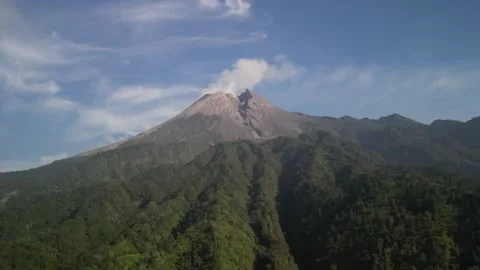 Aerial view of Merapi Volcano mountain covered by mist and fog in the morning Vídeos de archivo 290989208