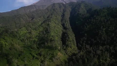 Aerial view of Merapi Volcano mountain covered by mist and fog in the morning Vídeos de archivo 290989209