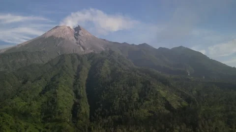Aerial view of Merapi Volcano mountain covered by mist and fog in the morning Vídeos de archivo 290989557