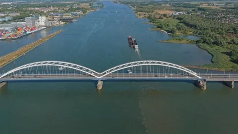 Aerial view of merwede bridge with cargo ship and traffic Stock Footage 344916868