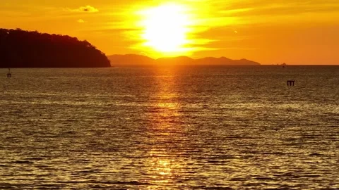 An aerial view of a mesmerizing sunset over the ocean. Stock Footage 308434626