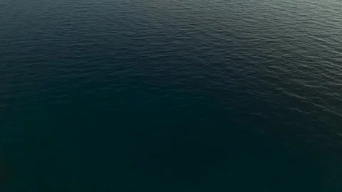 Aerial View: A mesmerizing view of ocean waves creating a stunning texture with Stock Footage 296077635