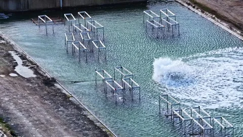 Aerial view of metal frames in a water tank in France. Stock Footage 340773239