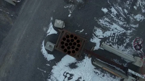 Aerial view of a metal object with small holes, pull back Stock Footage 155276794