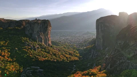 Aerial view of Meteora cliffs and valley in Greece during sunset Stock Footage 294784846