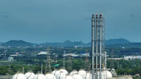 Aerial view of methane flaring from an industrial stack. Stock Footage 341662714