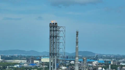 Aerial view of methane flaring from an industrial stack. Stock Footage 341662725