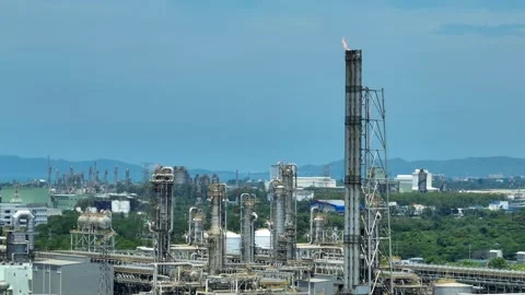 Aerial view of methane flaring from an industrial stack. Stock Footage 341662735