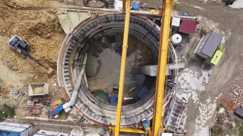 Aerial View of Metro Construction Shaft and Excavator Working Stock Footage 333370413