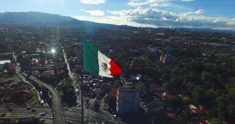 Aerial view of a mexican flag flutterin. Stock Footage 97761645