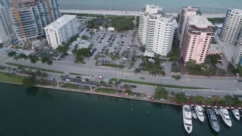 Aerial view of miami beach waterfront towers and marina Stock Footage 346263729