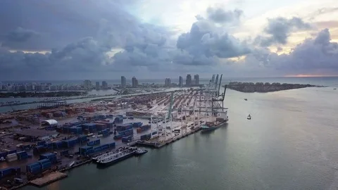 Aerial View Of Miami Loading Cranes By The Ocean With Ominous Clouds Video stock 82586147