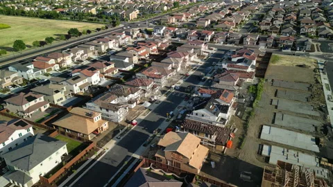 Aerial view of a middle class brand new residential houses neighborhood Stock Footage 274623838