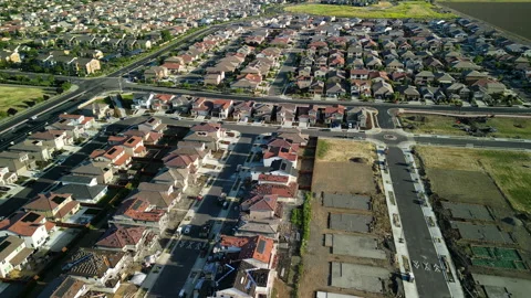 Aerial view of a middle class brand new residential houses neighborhood Stock Footage 274847751