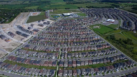 Aerial view of middle class residential houses stacked as tightly together .. Stock Footage 346728702