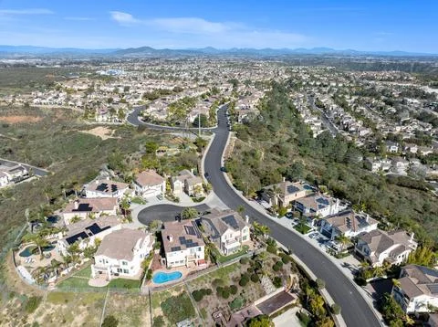 Aerial view of middle class subdivision neighborhood with residential houses in Stock Photos