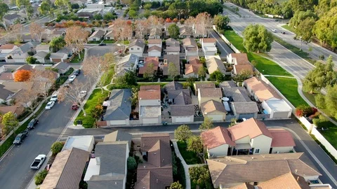 Aerial view of middle class suburban neighborhood with houses next to each other Stock Footage 121345898