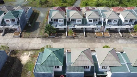 Aerial view of a minimalist housing complex with not too many houses Stock Footage 319427463
