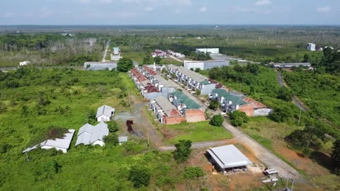 Aerial view of a minimalist housing complex with not too many houses Stock Footage 319427490
