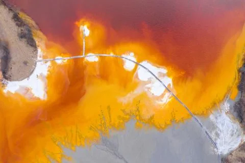 Aerial view of a mining decanting pond with toxic red residuals Stock-Fotos