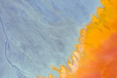 Aerial view of a mining decanting pond with toxic red residuals Stock Photos