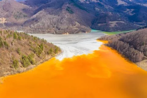 Aerial view of a mining decanting pond with toxic red residuals Stock Photos