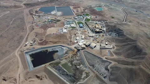 Aerial view of a mining operation in a desert landscape Stock Footage 337788574