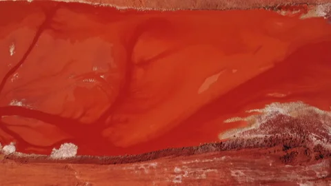 Aerial view of the mining of red clay. Industrial machines work in mining. Stock Footage 172434669