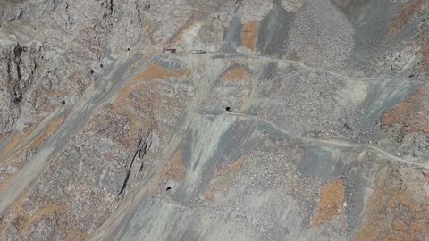 Aerial view of mining site with camera zooming in on excavation details Video stock 320393911