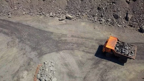 Aerial view A mining truck unloading iron ore. Stock Footage 116776926
