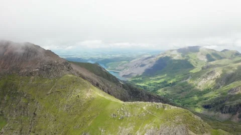 Aerial view of minors track going up to snowdon. view of lake at bottom of Stock Footage 197553124