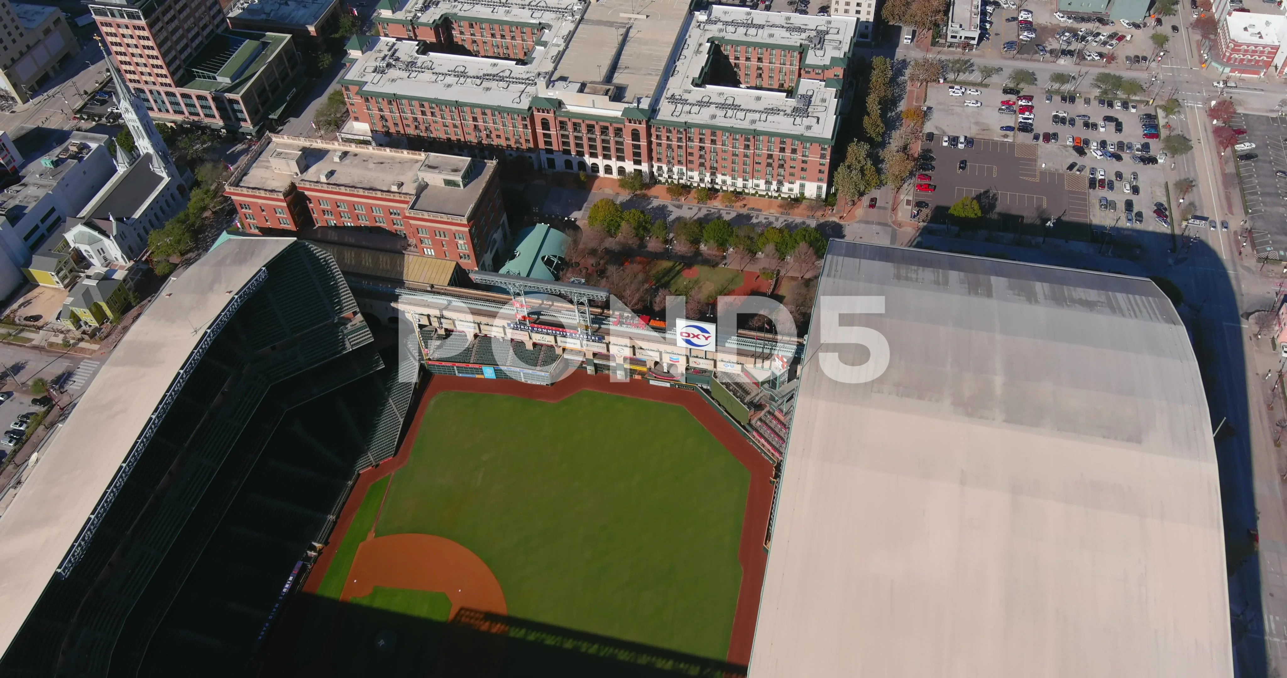 Aerial night view of Minute Maid Park with the roof opened in downtown  Houston