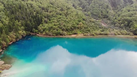 Aerial View of Mirror Reflection of Lake in Jiuzhaigou Sichuan China Video stock 336883630